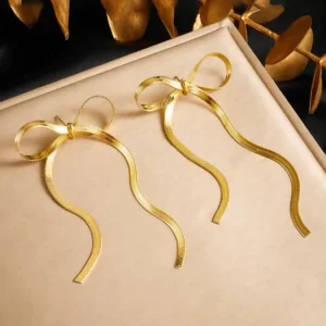top This Gold Plated Anti Tarnish Bow Themed Drop Earrings balances design, versatility, and craftsmanship, making it an ideal addition to any collection